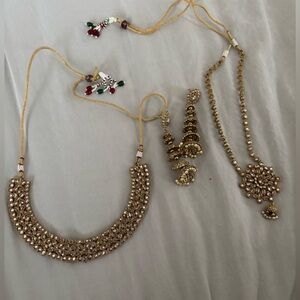 Two rose gold Indian jewelry sets
